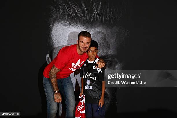 Global icon and footballing legend David Beckham greets 11 year old Ayaan Nadeem at the opening of the new adidas HomeCourt concept store in the Mall...