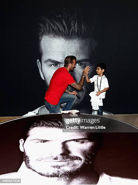 Global icon and footballing legend David Beckham high fives a fan as he opened the new adidas HomeCourt concept store in the Mall of Emirates, Dubai...