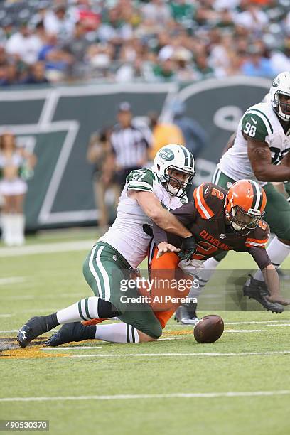 Linebacker Trevor Rielly of the New York Jets has a strip sack on Quarterback Johnny Manziel of the Cleveland Browns at MetLife Stadium on September...