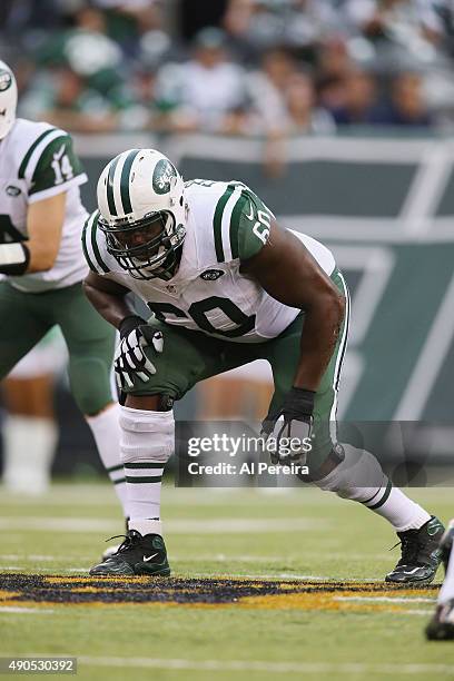 Left Tackle D'Brickashaw Ferguson blocks against the Cleveland Browns at MetLife Stadium on September 13, 2015 in East Rutherford, New Jersey.
