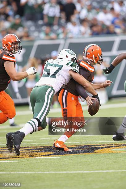 Linebacker Trevor Rielly of the New York Jets has a strip sack on Quarterback Johnny Manziel of the Cleveland Browns at MetLife Stadium on September...