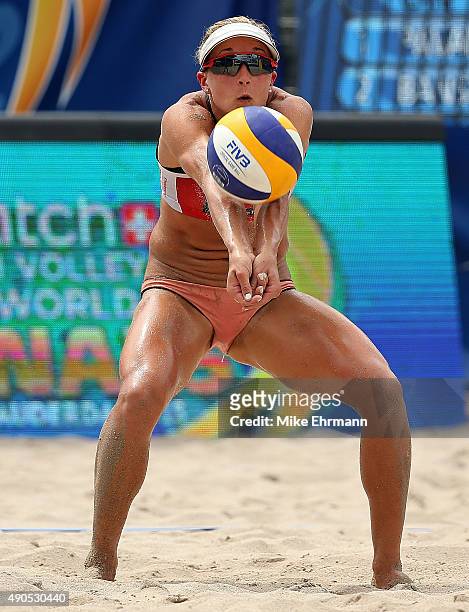 Heather Bansley of Canada plays a shot during a match against Emily Day and Jennifer Kessy of the United States during the 2015 Swatch FIVB World...