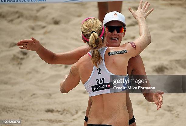 Jennifer Kessy and Emily Day of the United States reacts to a point during a match against Sarah Pavan and Heather Bansley of Canada during the 2015...