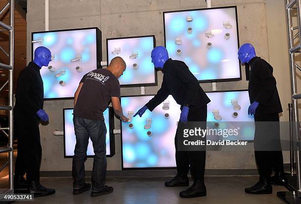 Zappos.com CEO Tony Hsieh and members of Blue Man Group use the "ShoeZaphone" after it was unveiled at Zappos headquaters on May 14, 2014 in Las...