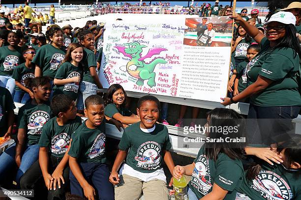 Carroll Peak Elementary students cheer during the Speeding To Read Kickoff Assembly at Texas Motor Speedway on September 29, 2015 in Fort Worth City.