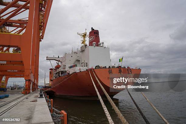 The Zhen Hua 19 heavy load carrier vessel sits at a dock ready to unload cranes at the Buenaventura Port in Buenaventura, Colombia, on Wednesday,...