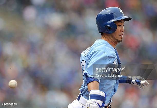Norichika Aoki of the Kansas City Royals runs out a bunt in the seventh inning during a game against the Colorado Rockies at Kauffman Stadium on May...