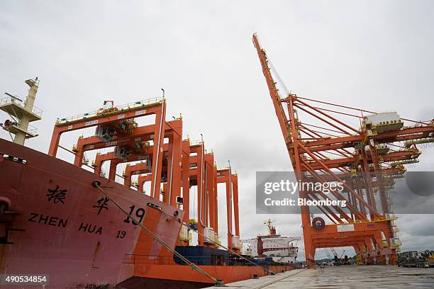 The Zhen Hua 19 heavy load carrier vessel sits at a dock ready to unload cranes at the Buenaventura Port in Buenaventura, Colombia, on Wednesday,...