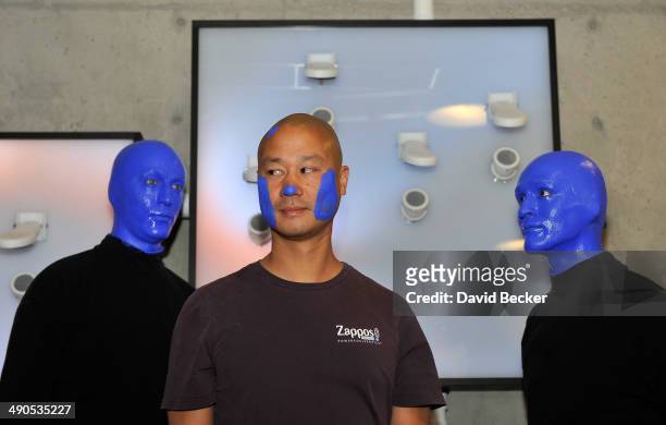Zappos.com CEO Tony Hsieh and members of Blue Man Group appear during the unveiling of the "ShoeZaphone" at Zappos headquaters on May 14, 2014 in Las...
