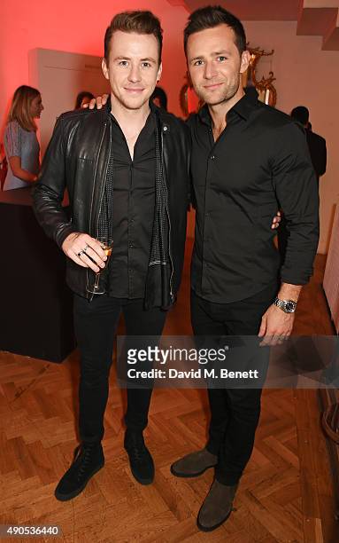 Danny Jones and Harry Judd attend "Above / Beyond" hosted by American Airlines at One Marylebone on September 29, 2015 in London, England.