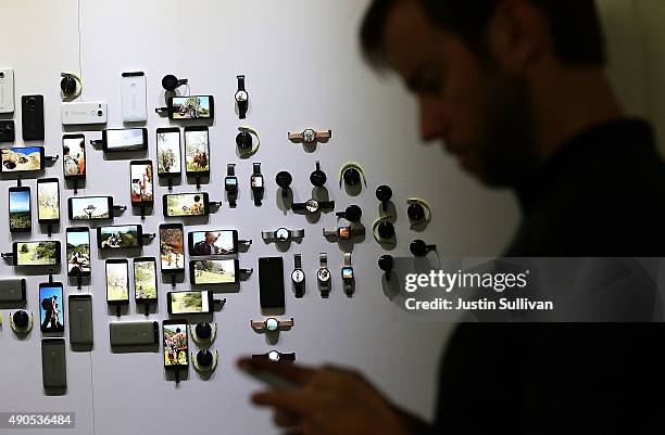 An attendee stands by a display of new Google devices during a Google media event on September 29, 2015 in San Francisco, California. Google unveiled...