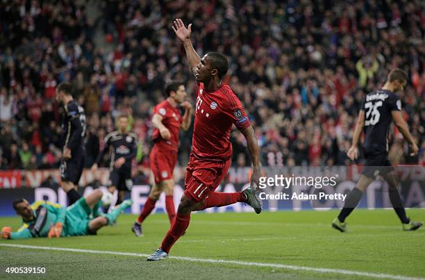 Douglas Costa of Bayern Muenchen celebrates his opening goal during the UEFA Champions League Group F match between FC Bayern Munchen and GNK Dinamo...