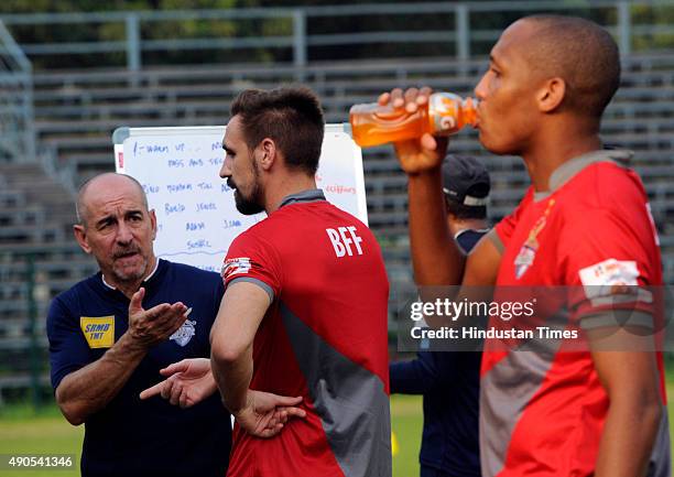 Atletico de Kolkata Head Coach Antonio Habas with player Borja Fernandez during practice ahead of the second edition of Indian Super League at Mohun...