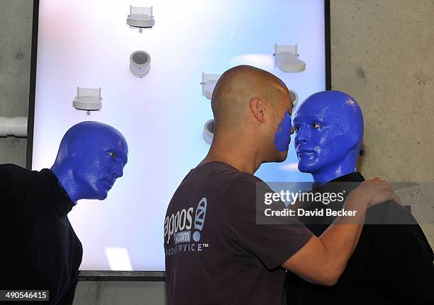 Zappos.com CEO Tony Hsieh and members of Blue Man Group appear during the unveiling of the "ShoeZaphone" at Zappos headquaters on May 14, 2014 in Las...