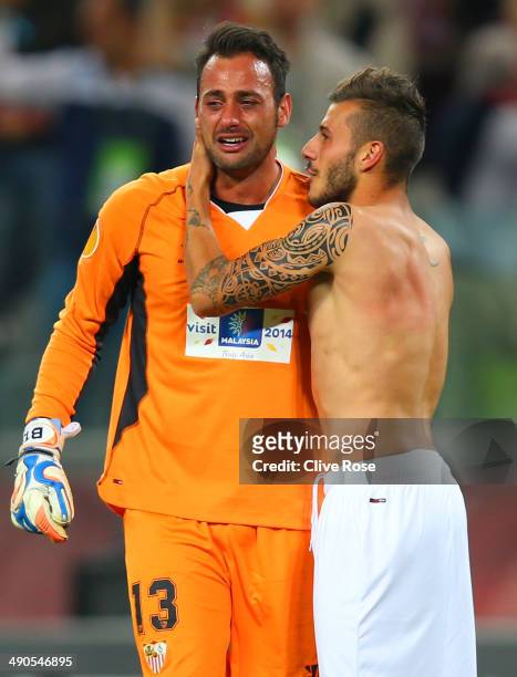 Beto of Sevilla celebrates victory with Diogo Figueiras of Sevilla during the UEFA Europa League Final match between Sevilla FC and SL Benfica at...