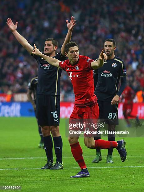 Robert Lewandowski of Bayern Muenchen celebrates scoring his teams fifth goal during the UEFA Champions League Group F match between FC Bayern...