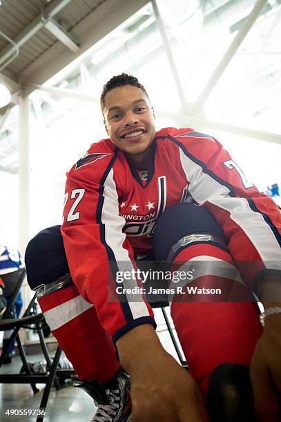 Madison Bowey of the Washington Capitals ties his skates ahead of a photo shoot at the 2015 NHLPA Rookie Showcase at Mattamy Athletic Centre on...