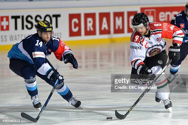 Dustin Friesen battles with Spencer Abbott during the Champions Hockey League round of thirty-two game between ERC Ingolstadt and Frolunda Gothenburg...
