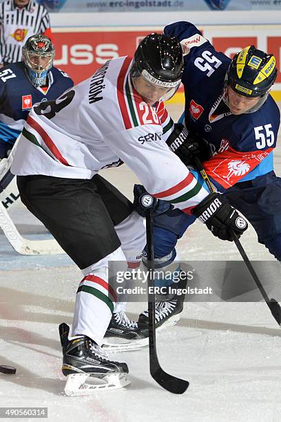 Patrick Koeppchen battles with Johan Sundstrom during the Champions Hockey League round of thirty-two game between ERC Ingolstadt and Frolunda...