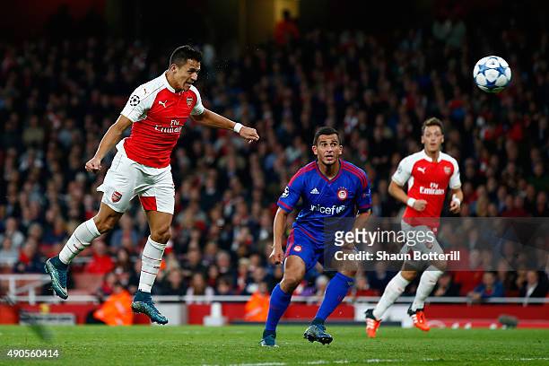 Alexis Sanchez of Arsenal scores his teams second goal with a header during the UEFA Champions League Group F match between Arsenal FC and Olympiacos...
