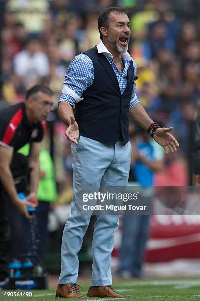 Gustavo Matosas coach of Atlas shouts on during a 2nd round match between America and Atlas as part of the Apertura 2015 Liga MX at Azteca Stadium on...