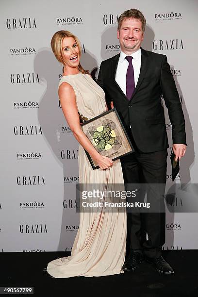 Mareile Hoeppner and Arnim Fischer attend the Pandora At Grazia Best Dressed Award at Soho House on May 14, 2014 in Berlin, Germany.