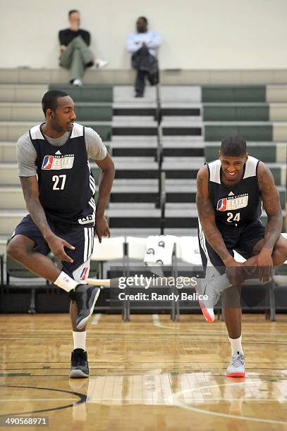 Leslie of the Idaho Stampede and DeQuan Jones of the Reno Bighorns participate in a warmup drill on day two of the 2014 NBA Development League Elite...