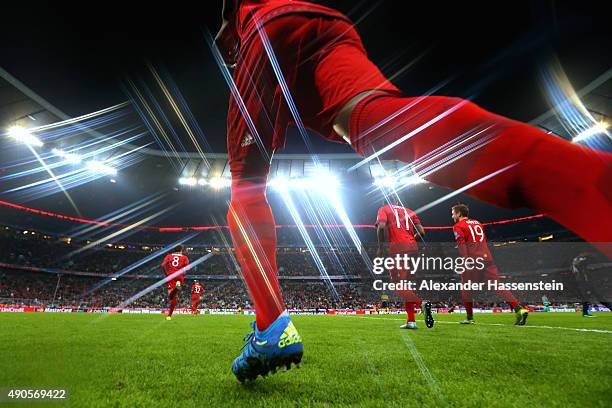 David Alaba of Bayern Muenchen enters the field with his team mates for the UEFA Champions League Group F match between FC Bayern Munchen and GNK...