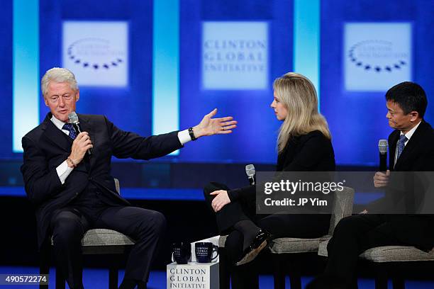 President Bill Clinton speaks as Elizabeth Holmes, founder and CEO of Theranos and Jack Ma, Executive Chairman of Alibaba Group, listens during the...