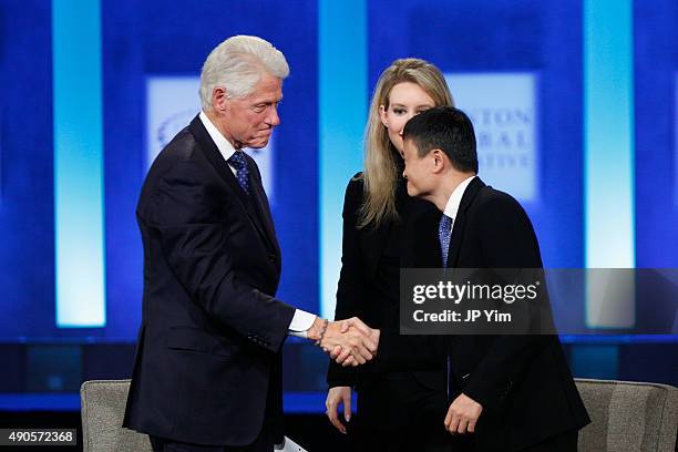 President Bill Clinton shakes hands with Jack Ma, Executive Chairman of Alibaba Group, during the closing session of the Clinton Global Initiative...