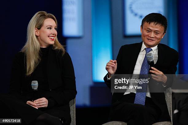 Jack Ma, Executive Chairman of Alibaba Group speaks on stage as Elizabeth Holmes listens during the closing session of the Clinton Global Initiative...
