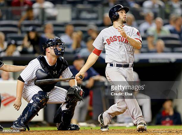 Blake Swihart of the Boston Red Sox hits a two run home run in the eighth inning as Brian McCann of the New York Yankees defends on September 29,...