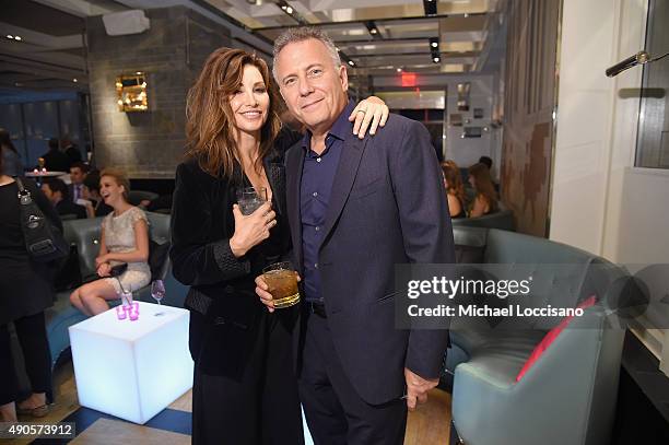 Actors Gina Gershon and Paul Reiser attend the Amazon red carpet premiere for the brand new original comedy series "Red Oaks" on September 29, 2015...