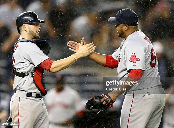 Blake Swihart and Jean Machi of the Boston Red Sox celebrate the win over the New York Yankees on September 29, 2015 at Yankee Stadium in the Bronx...