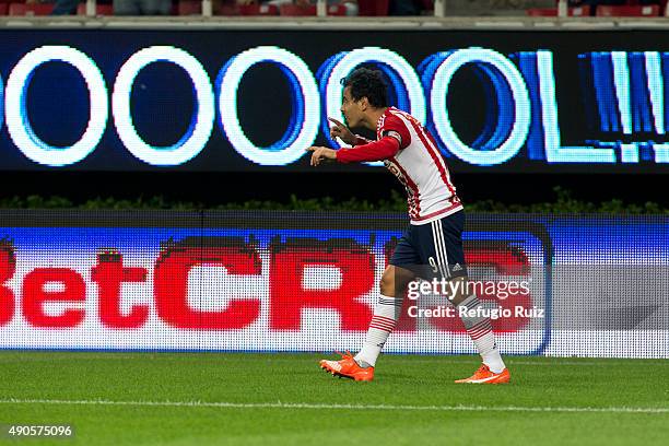 Omar Bravo of Chivas celebrates after scoring the first goal of his team during the 11th round match between Chivas and Monterrey as part of the...