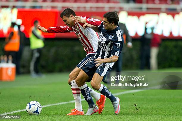 Jorge Enriquez of Chivas fights for the ball with Neri Cardozo of Monterrey during the 11th round match between Chivas and Monterrey as part of the...