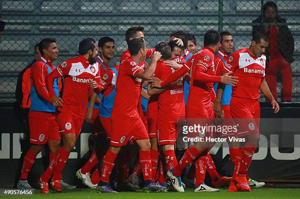 Omar Arellano of Toluca celebrates with teammates after scoring the third goal of his team during the 11th round match between Toluca and Tijuana as...