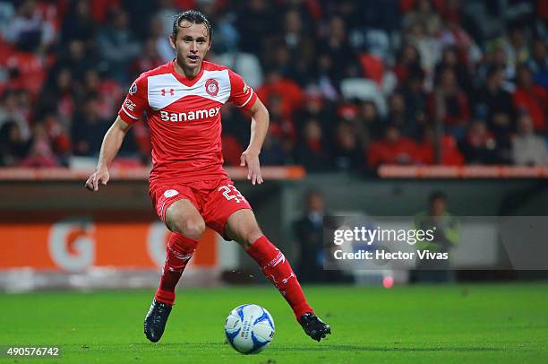 Omar Arellano of Toluca drives the ball during the 11th round match between Toluca and Tijuana as part of the Apertura 2015 Liga MX at Nemesio Diez...