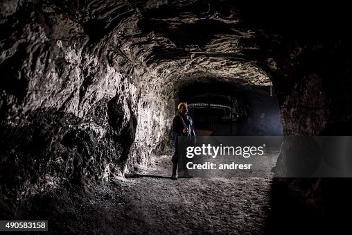 Miner working at a mine underground Miner working at a mine underground
