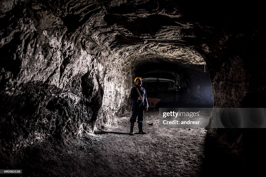 Miner working at a mine underground