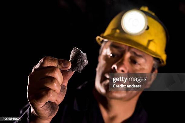 man working at a mine - miner pick stock pictures, royalty-free photos & images