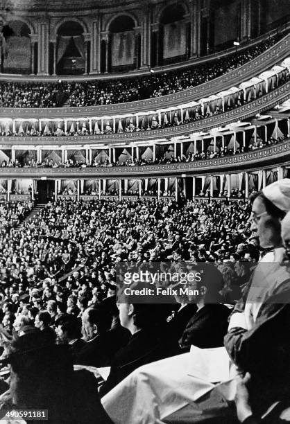 An audience during a concert at the Royal Albert Hall in London, 1942. Original Publication: Picture Post - 1196 - London Goes Music Mad - pub. 18th...