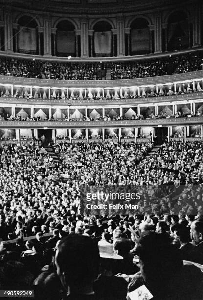 An audience during a concert at the Royal Albert Hall in London, 1942. Original Publication: Picture Post - 1196 - London Goes Music Mad - pub. 18th...