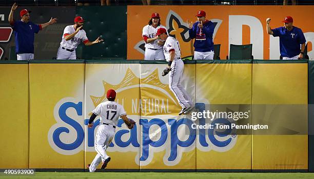Shin-Soo Choo of the Texas Rangers celebrates as Drew Stubbs of the Texas Rangers fields a fly ball for the final out in the top of the ninth inning...