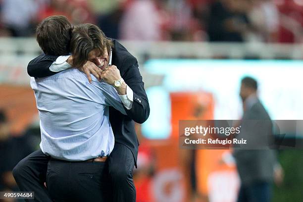 Matias Almeyda coach of Chivas celebrates with his assistant coach Gabriel Amato after the 11th round match between Chivas and Monterrey as part of...