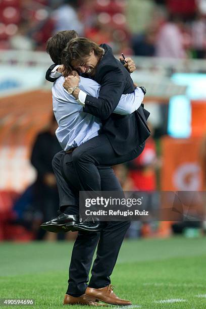 Matias Almeyda coach of Chivas celebrates with his assistant coach Gabriel Amato after the 11th round match between Chivas and Monterrey as part of...