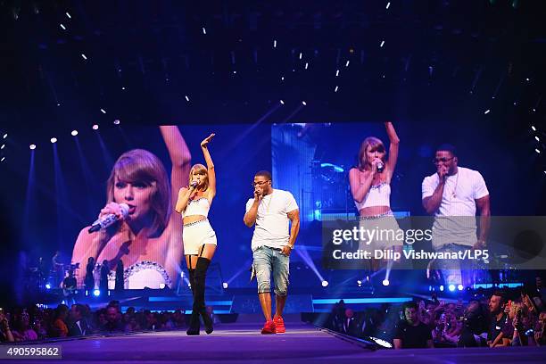 Taylor Swift performs with special guest Nelly onstage during the 1989 World Tour at Scottrade Center on September 29, 2015 in St Louis, Missouri.