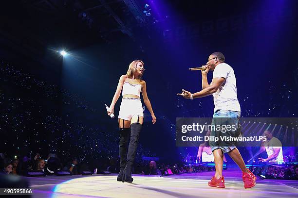 Taylor Swift performs with special guest Nelly onstage during the 1989 World Tour at Scottrade Center on September 29, 2015 in St Louis, Missouri.