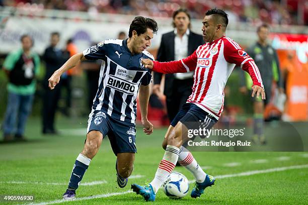 Marco Fabian of Chivas fights for the ball with Efrain Juarez of Monterrey during the 11th round match between Chivas and Monterrey as part of the...