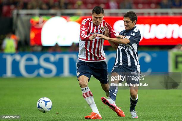 Jorge Enriquez of Chivas fights for the ball with Neri Cardozo of Monterrey during the 11th round match between Chivas and Monterrey as part of the...